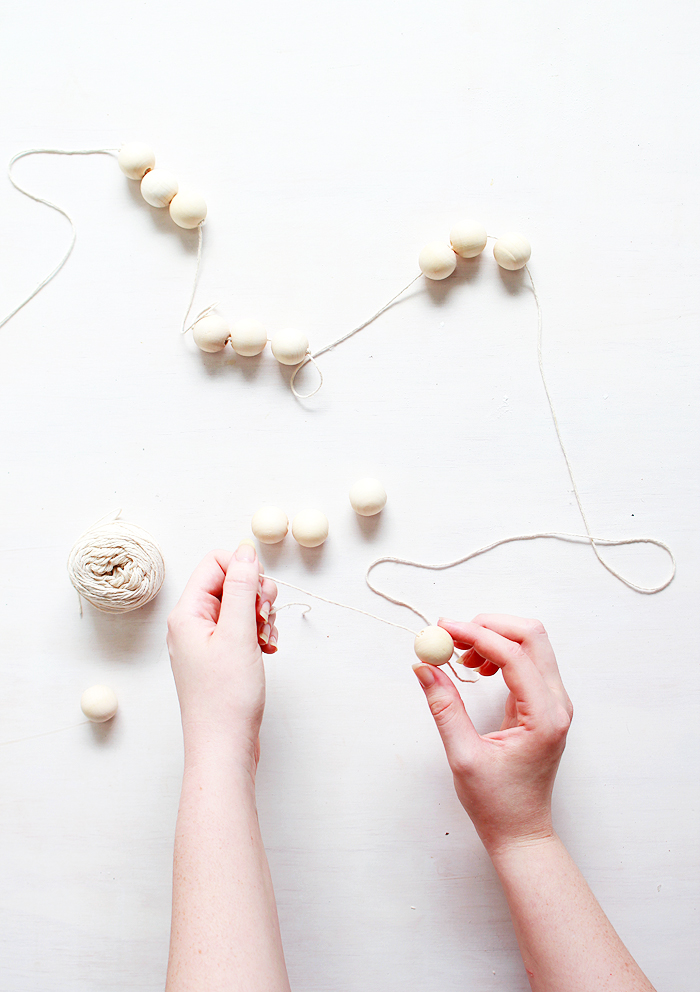It only takes 5 minutes to make these simple wooden bead garlands! 